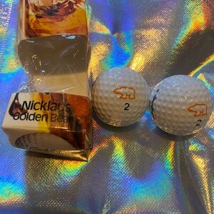 Vintage golf balls from the "Nicklaus Golden Bear" line set of 2